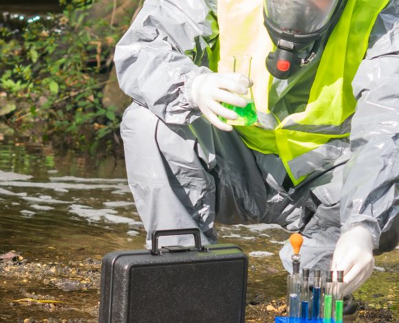 Technician in hazmat suit
