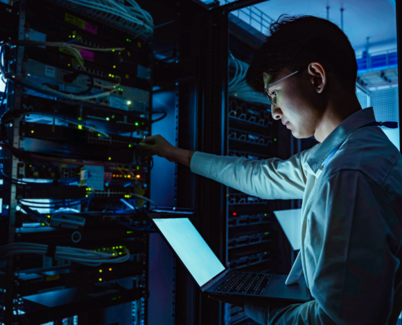 a male working on network servers