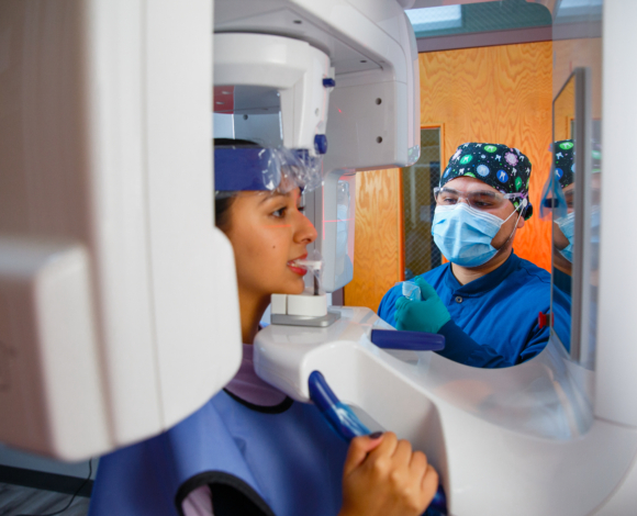 two students practicing in a dental lab simulation