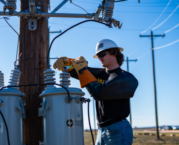 electrical lineworker student working on the line